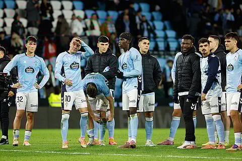 Celta players gather on the pitch at the end of the Spanish La Liga soccer match between Celta Vigo and Barcelona in Vigo, Spain.