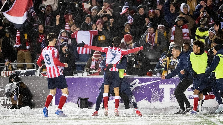 Atletico Ottawa's David Rodriguez (7) celebrates his with teammates and Atletico fans during the Canadian Premier League final against Cavalry FC. - Spencer Colby/The Canadian Press via AP