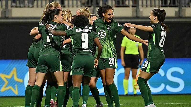 VfL Wolfsburg players celebrate after Paris St. Germain's Jackie Groenen scored an own goal during a Women's Champions League match in Wolfsburg, Germany. - Swen Pfortner/dpa via AP