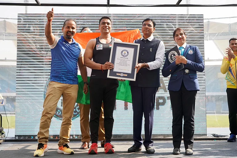 Rohtash Chaudhary with Union Sports Minister Mansukh Mandaviya - File Photo