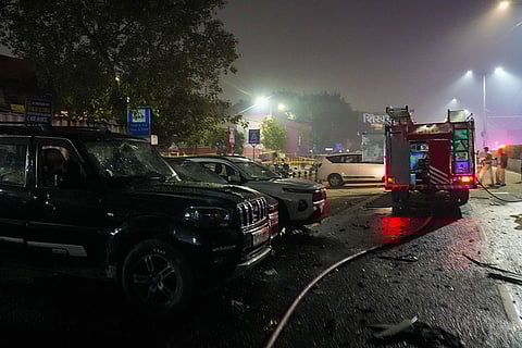Damaged vehicles at the spot after a blast occurred in a parked car near Red Fort, leaving multiple vehicles in flames, in New Delhi.