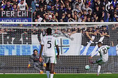 Sassuolo's Domenico Berardi, right, scores the opening goal during a Serie A soccer match between Atalanta and Sassuolo, in Bergamo, northern Italy.