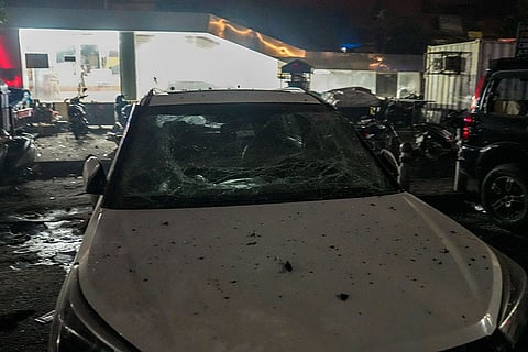 A damaged vehicle at the spot after a blast occurred in a parked car near Red Fort, leaving multiple vehicles in flames, in New Delhi.