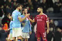| Photo: AP/Jon Super : Manchester City's Ruben Dias, left, Manchester City's Bernardo Silva, centre, Liverpool's Mohamed Salah after the English Premier League soccer match between Manchester City and Liverpool in Manchester, England.