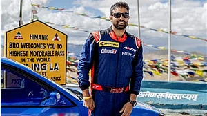 Special Arrangement : Sanam Sekhon posing with the Lexus GS300 car, which he used for the Guinness World Record drift, at Umling La Pass in Ladakh.