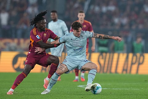 Roma's Manu Kone, left, challenges Udinese's Nicolo Zaniolo during the Serie A soccer match between Roma and Udinese, in Rome.