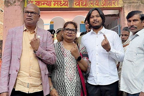 Bihar Congress chief Rajesh Ram (left) shows his ink-marked finger after casting a vote during the second and final phase of the state Assembly elections, in Aurangabad.