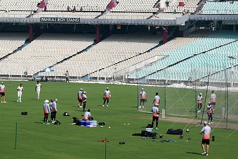 Indian cricketers practice ahead of the first test match between India and South Africa, in Kolkata.