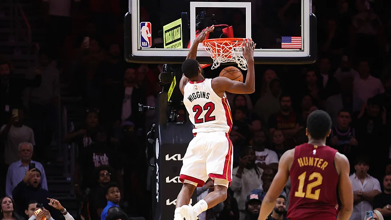 Andrew Wiggins #22 of the Miami Heat dunks the ball in overtime to defeat the Cleveland Cavaliers at Kaseya Center on November 10, 2025 in Miami, Florida. - null