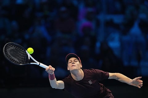 Italy's Jannik Sinner returns the ball to Canada's Felix Auger-Aliassime during their tennis match of the ATP World Tour Finals, in Turin, Italy.