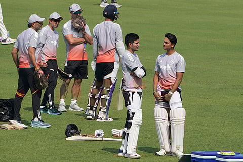 Yashasvi Jaiswal, right, talks with captain Subman Gill as chief coach Gautam Gambhir, second left, watches during a practice session ahead of the first test match between India and South Africa, in Kolkata.