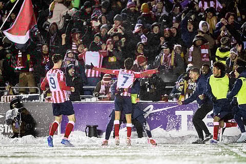 Atletico Ottawa's David Rodríguez (7) celebrates with teammates and Atletico fans following his goal on Cavalry FC's Marco Carducci (1), not pictured, during extra time Canadian Premier League finals soccer action in Ottawa.