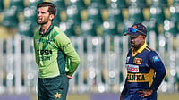 AP/Anjum Naveed : Pakistan's Shaheen Shah Afridi, left, and Sri Lanka's Charith Asalanka wait for coin toss before start of the first one day international cricket match.