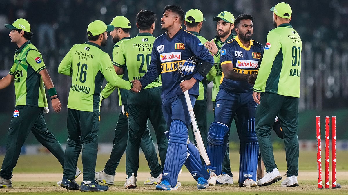 Sri Lanka's Mahesh Theekshana, centre, and Asitha Fernando, second right, shakes hand with Pakistani players on the end of the first one day international cricket match between Pakistan and Sri Lanka, in Rawalpindi, Pakistan, Tuesday, Nov. 11, 2025 - AP Photo/Anjum Naveed