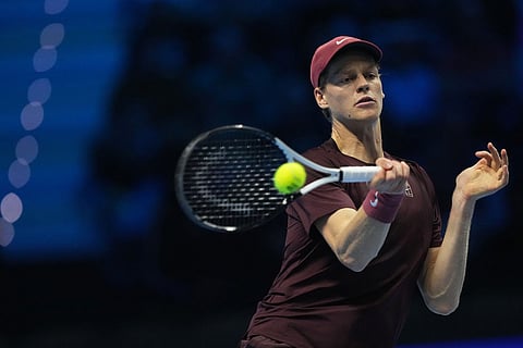 Italy's Jannik Sinner returns the ball to Canada's Felix Auger-Aliassime during their tennis match of the ATP World Tour Finals, in Turin, Italy.