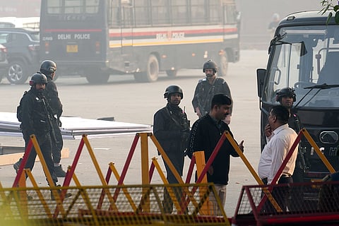 National Security Guard (NSG) commandos at the site in the aftermath of the blast that occurred near Red Fort Metro Station on Monday, killing at least nine people and gutting several vehicles, in New Delhi.