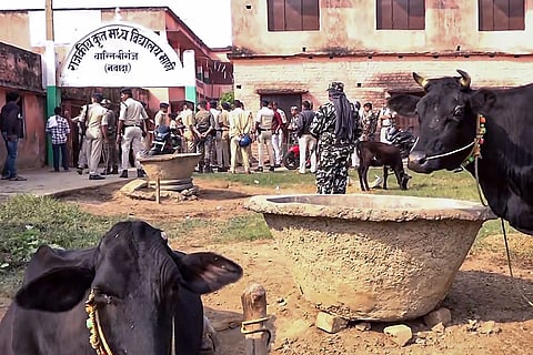 Police personnel outside a government school after a clash broke out between Jan Suraaj supporters and BJP workers in the Barbigha area of Warisaliganj constituency, in Nawada district.