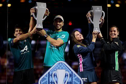 Federico Chingotto, Alejandro Galan, Claudia Fernandez Sanchez and Ariana Sanchez Fallada pose with their winner trophies during the trophy ceremony of the FIP World Cup in Pairs, Kuwait on November 9, 2025
