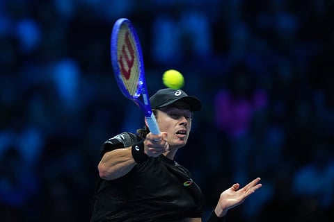 Australia's Alex de Minaur returns the ball to Italy's Lorenzo Musetti during their tennis match of the ATP World Tour Finals, in Turin, Italy.