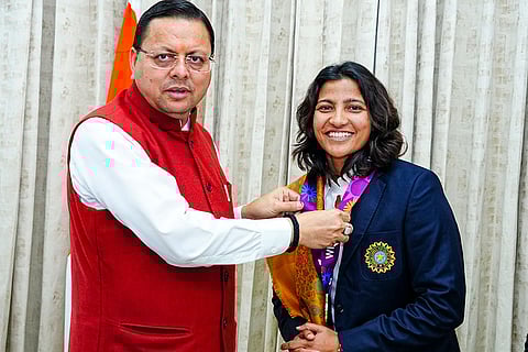 In this image, Uttarakhand Chief Minister Pushkar Singh Dhami felicitates Sneh Rana, member of the Women's ODI World Cup 2025-winning Indian cricket team. ()()