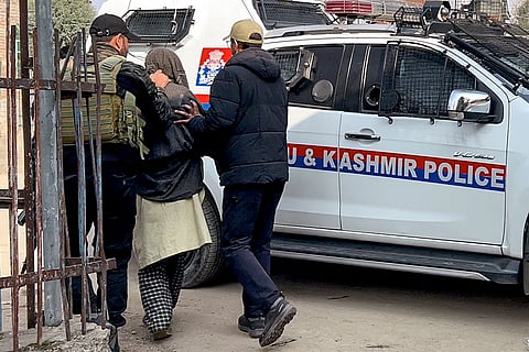 Father of the man suspected to be driving the car that exploded near the Red Fort being detained by police personnel for questioning, in Pulwama district, Jammu and Kashmir.