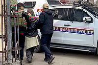 Red Ford EcoSport Linked To Red Fort Blast Suspect Seized In Faridabad | Photo: PTI : Father of the man suspected to be driving the car that exploded near the Red Fort being detained by police personnel for questioning, in Pulwama district, Jammu and Kashmir.