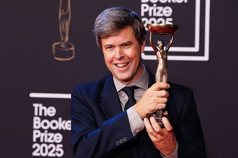 Author David Szalay poses for a photo after being named as the winner of the 2025 Booker Prize for the novel "Flesh," at Old Billingsgate, in London, Monday, Nov. 10, 2025. - Ian West/AP