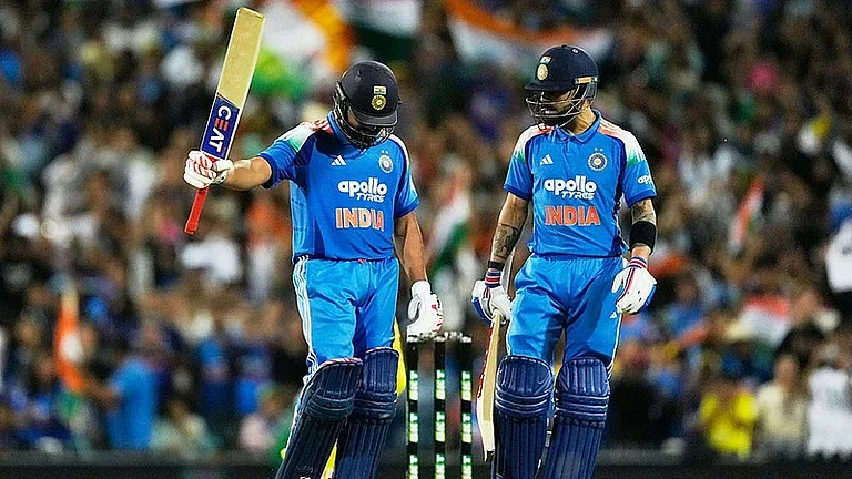 Virat Kohli and Rohit Sharma stitched an unbeaten 168-run partnership for India against Australia in Sydney. - AP