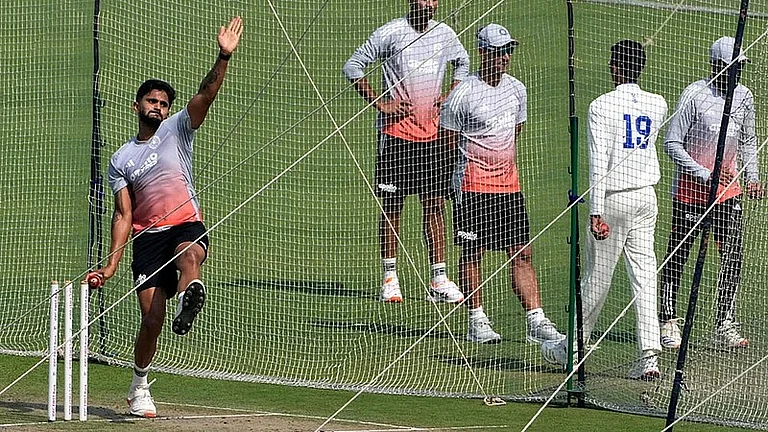 Nitish Kumar Reddy (left) bowls in the nets during a practice session ahead of the first Test between India and South Africa, in Kolkata. - AP
