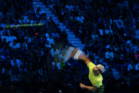 Spain's Carlos Alcaraz serves the ball to United States' Taylor Fritz during their tennis match of the ATP World Tour Finals, in Turin, Italy.