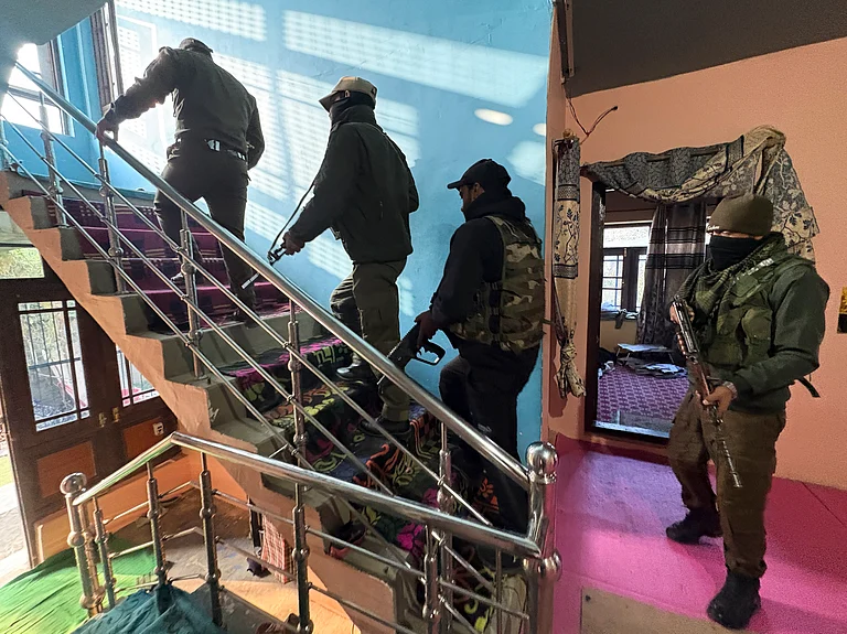 Kulgam: Security personnel during a crackdown against the banned organisation Jamaat-e-Islami (JeI), in Kulgam, Jammu and Kashmir, Wednesday, Nov. 12, 2025. - -