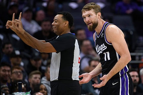 Sacramento Kings forward/center Domantas Sabonis (11) argues an official's call with referee Karl Lane during the second half of an NBA basketball game in Sacramento, California.