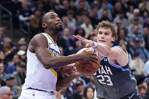 Indiana Pacers guard Aaron Nesmith, left, drives against Utah Jazz forward Lauri Markkanen (23) during the second half of an NBA basketball game in Salt Lake City. 
