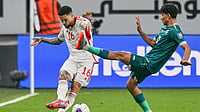 AP Photo : Marcous Vinicius of the UAE, left, passes the ball past Iraqi's Ali Jasim during the 2026 World Cup play off first leg soccer match between UAE and Iraq in Abu Dhabi, United Arab Emirates, Thursday, Nov. 13, 2025