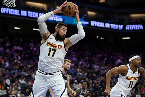 Denver Nuggets center Jonas Valančiūnas (17) pulls down a rebound during the second half of an NBA basketball game against the Sacramento Kings in Sacramento, California.