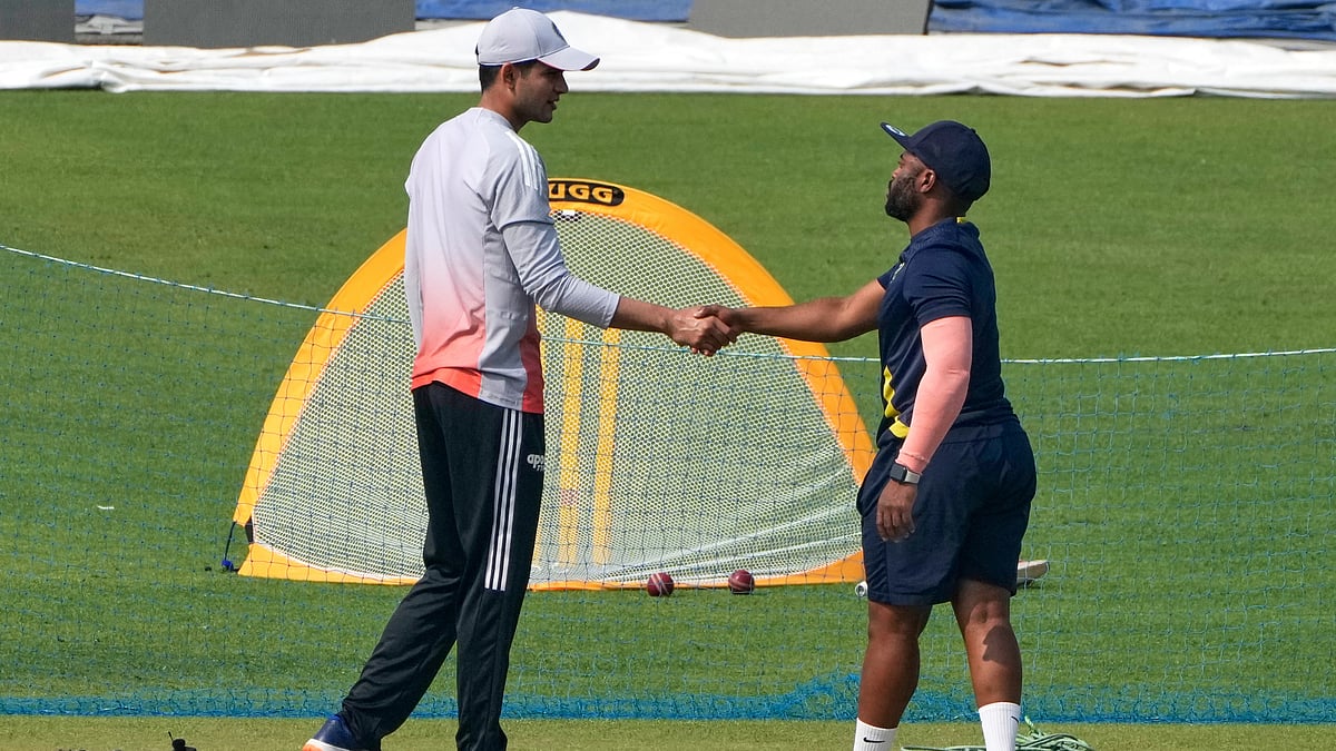 AP/Bikas Das : South Africa captain Temba Bavuma, right, and India captain Shubman Gill shake hands during the practice session ahead of a first test match.
