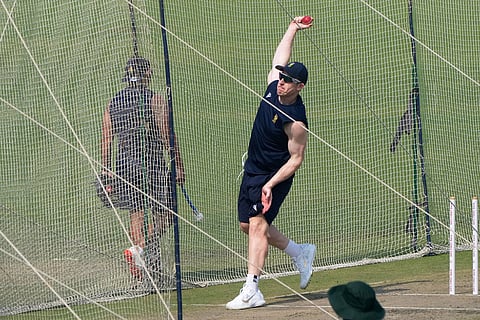 Simon Harmer bowls at the net during the practice session ahead of the first test match between India and South Africa, in Kolkata.