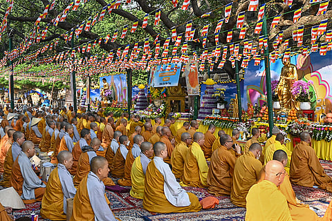 Members of the Vietnam Buddhist Sangha offer prayers for world peace at the Mahabodhi Temple, in Bodh Gaya.
