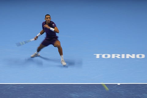 Canada's Felix Auger-Aliassime returns the ball to United States' Ben Shelton during their tennis match of the ATP World Tour Finals, in Turin, Italy.
