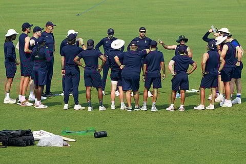 South Africa cricketers with coaches and staffs join an onfield meeting during the practice session ahead of the first test match between India and South Africa, in Kolkata.