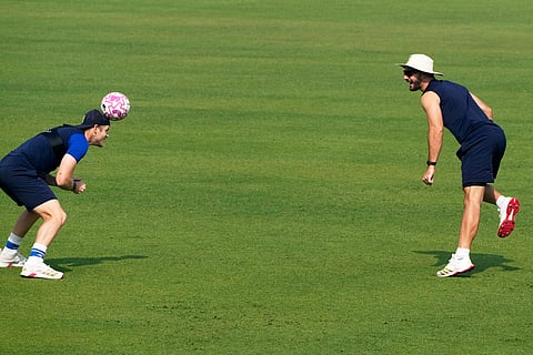South Africa's Adien Markram, right and Corbin Bosch play football during the practice session ahead of the first test match between India and South Africa, in Kolkata.