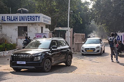 Vehicles exit the Al-Falah University amid investigation in the aftermath of a blast near the Red Fort, in Faridabad, Haryana. Dr Umar Nabi, an assistant professor at the university, is said to have been driving the car that exploded on Monday, according to officials. 