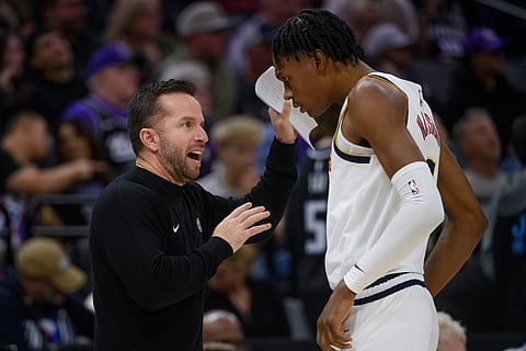 Denver Nuggets Assistant Coach JJ Barea coaches guard Peyton Watson during a timeout in the second half of an NBA basketball game against the Sacramento Kings in Sacramento, California.