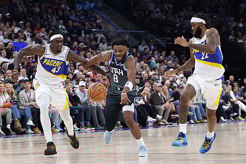 Utah Jazz guard Isaiah Collier (8) runs for the ball with Indiana Pacers forward Pascal Siakam (43) and forward Isaiah Jackson (22) during the first half of an NBA basketball game in Salt Lake City. 