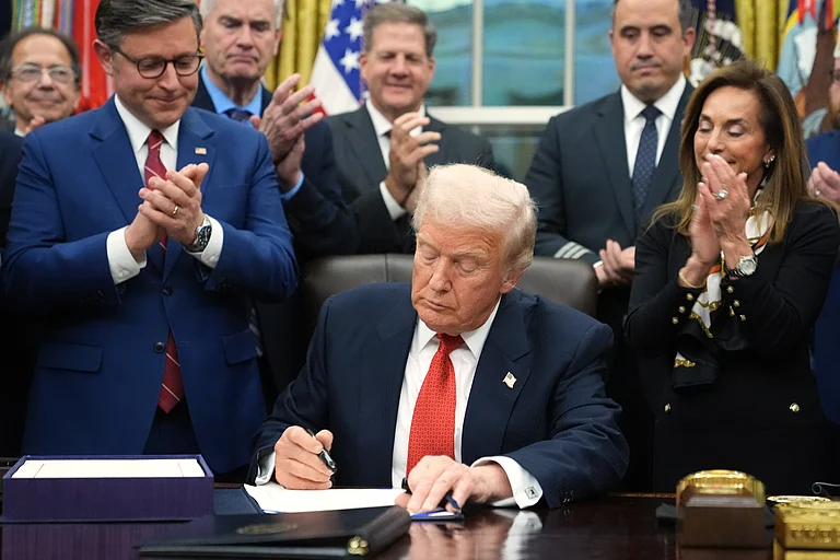 President Donald Trump signs the funding bill to reopen the government, in the Oval Office of the White House, Wednesday, Nov. 12, 2025, in Washington. - (AP Photo/Jacquelyn Martin)