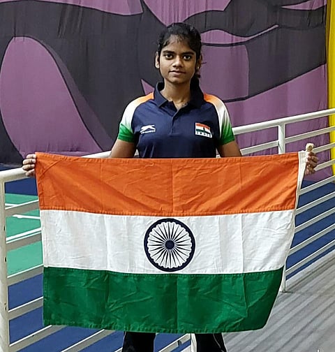 Shuttler Jerlin Jayaratchagan, who will be will be India’s flagbearer at the Tokyo Deaflympics, poses with the tri-colour.