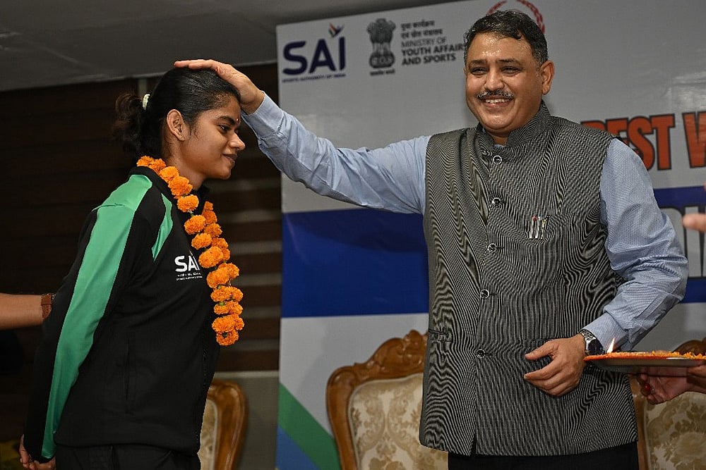 Sports secretary Hari Ranjan Rao with Jerlin Jayaratchagan