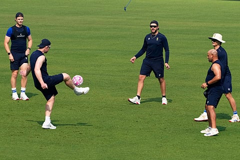 South Africa's Adien Markram, center and others play football during the practice session ahead of the first test match between India and South Africa, in Kolkata.