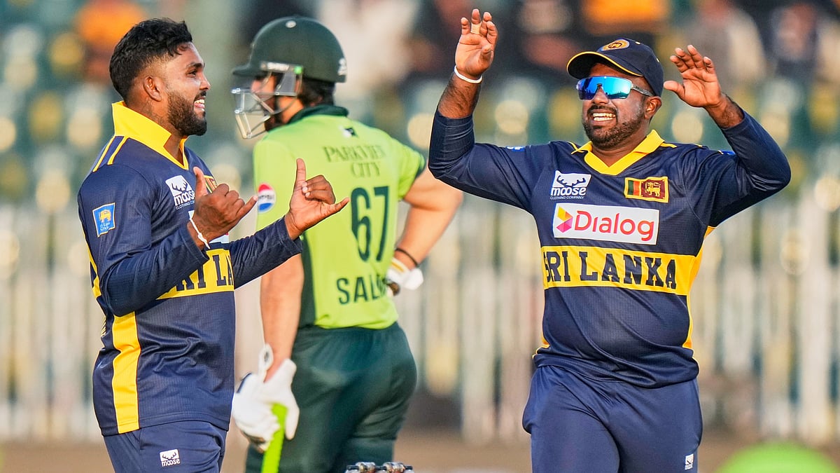 Sri Lanka's Wanindu Hasaranga celebrates with teammate after the dismissal of Pakistan's Babar Azam during the first ODI match in Rawalpindi on Tuesday, November 11, 2025. - | Photo: AP/Anjum Naveed