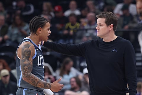 Utah Jazz guard Keyonte George (3) and head coach Will Hardy speak during a break in action against the Indiana Pacers during the first half of an NBA basketball game in Salt Lake City.